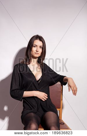 Beautiful lady posing in studio on gray background. Sexy lady. Perfect beautiful attractive female posing in model test in studio