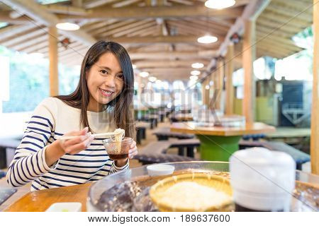 Woman having famous japanese somen in restaurant