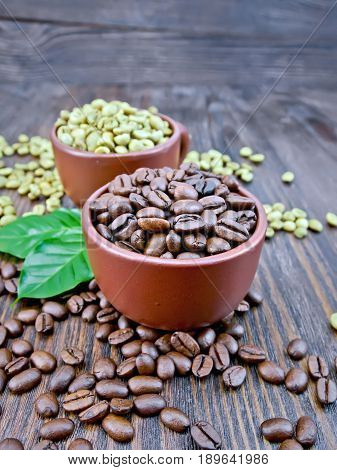 Coffee Black And Green Grains In Cups With Leaf On Board