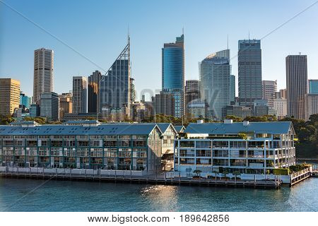 Historic Woolloomooloo Wharf With Sydney Cbd Skyscrapers On The Background