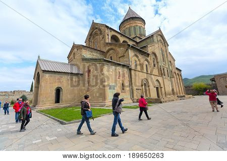 Mtskheta, Georgia - April 28, 2017: Peole near Svetitskhoveli Cathedral located in the historical town of Mtskheta, Georgia