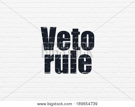 Political concept: Painted black text Veto Rule on White Brick wall background