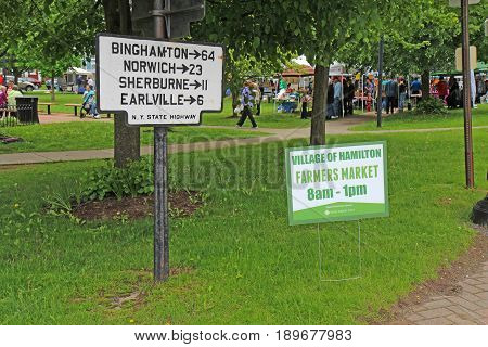 HAMILTON NEW YORK - MAY 27 2017: Sign for the local farmers market in the village of Hamilton near Colgate University in upstate New York.