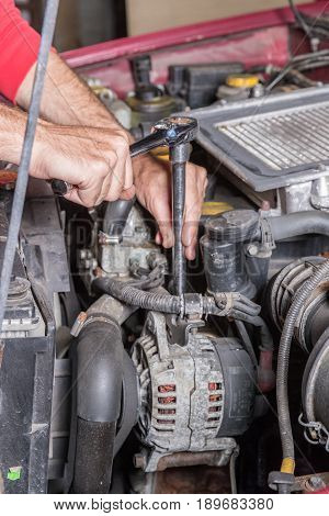 Mechanic Working On A Car Engine