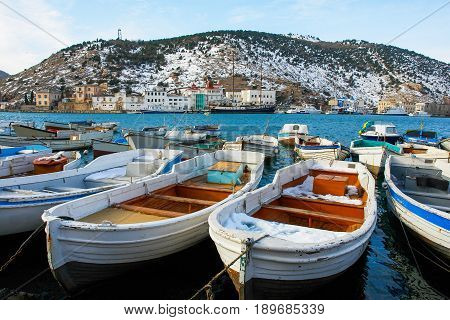 Boats in winter. The composition of the winter landscape.