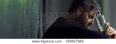Hopeless Man Holding Alcohol Bottle