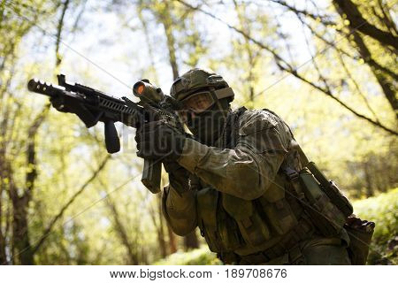 Officer aims keeping machine gun in forest on mission