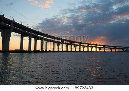 Section of the Western High-Speed Diameter against the background of a decline in the May evening. Saint-Petersburg, Russia