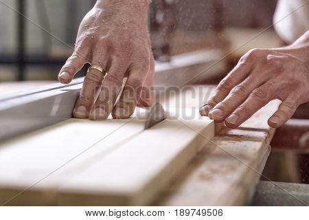 The Joiner Saws A Piece Of Wood In 2 Parts On With Electric Tool