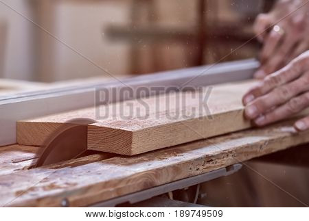 The Joiner Saws A Piece Of Wood In 2 Parts On With Electric Tool