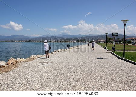 31ST MAY 2017,FETHIYE, TURKEY: Tourists walking along the promanade in the port of Fethiye in Turkey, 31st may, 2017