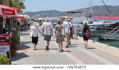 31ST MAY 2017,FETHIYE, TURKEY: Tourists walking along the promanade in the port of Fethiye in Turkey, 31st may, 2017