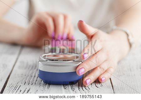 Woman using credit card to pay in pos