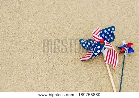 Patriotic USA background with decorations on the sandy beach