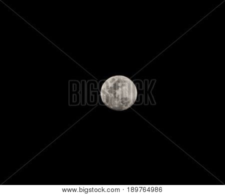 Full moon on a dark spring night