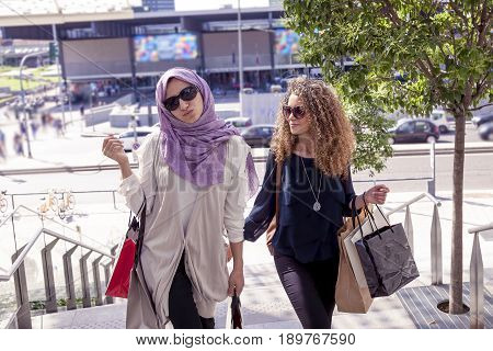 Two Beautiful Girls With Shopping Bags