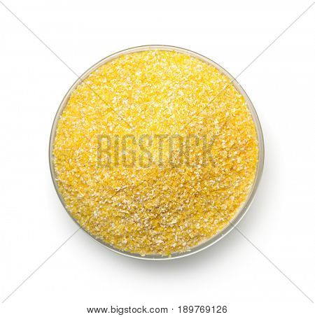 Top view of bowl with corn grits isolated on white