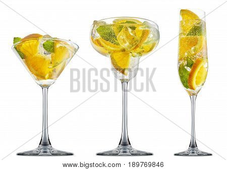fresh fruit alcohol cocktail or mocktail in margaritta, martini, champagne glass with ice cubes, orange and mint isolated on white background