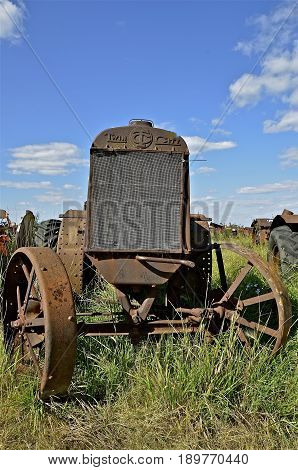 BARNESVILLE, MINNESOTA, June 14, 2014: The old rusty tractor is a product of Twin City Tractors, built by the Minneapolis Steel & Machinery Company until 1929 when it merged with the Moline Implement Company of Illinois and the Minneapolis Threshing Machi