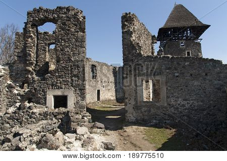 Ruins of Castle Nevytske near of Transcarpathian region center Uzhgorod photo. Nevitsky Castle ruins built in 13th century. Ukraine.