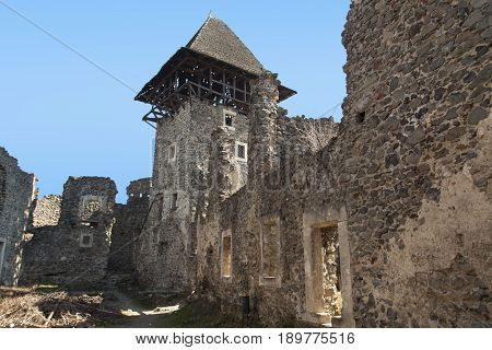 Ruins of Castle Nevytske near of Transcarpathian region center Uzhgorod photo. Nevitsky Castle ruins built in 13th century. Ukraine.
