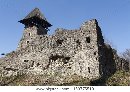 Ruins of Castle Nevytske near of Transcarpathian region center Uzhgorod photo. Nevitsky Castle ruins built in 13th century. Ukraine.