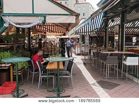 VIENNA, AUSTRIA-JUNE 01, 2017: People enjoy the Naschmarkt in Vienna, Austria