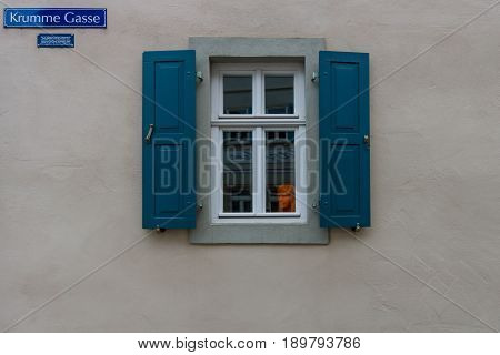 SCHWEINFURT GERMANY - APRIL 21 2017: An unusual orange bust in the window on an ancient street in the center of the city. Schweinfurt - a medieval city founded in 761 year.