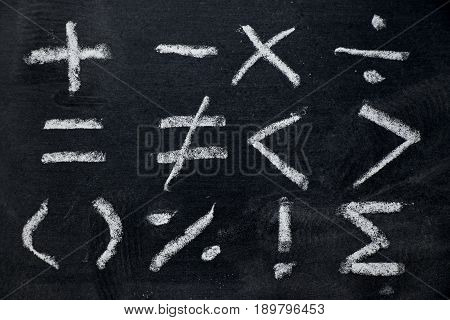 Set of math symbol draw by white chalk on blackboard background
