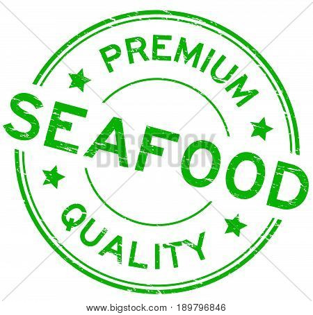 Grunge green premium quality seafood round rubber seal stamp on white background