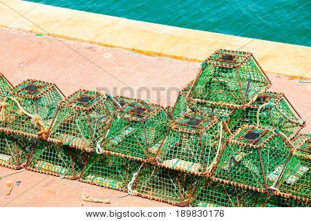 Lobster pots and crab pots drying in the sun on the pier