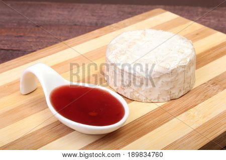 Cheese with white mold. Camembert or brie type with Cranberry sauce.. Healthy breakfast