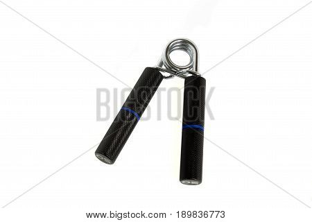 Manual spring loaded carpal expander with metal handles isolated on white background