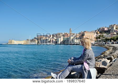 Woman relaxes on the seafront of Gaeta Lazio Italy