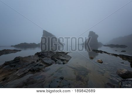 Magnificent seascape over the rock phenomenon The Ships, Sinemorets village, Bulgaria. Foggy weather.