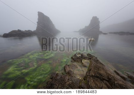 Magnificent seascape over the rock phenomenon The Ships, Sinemorets village, Bulgaria. Foggy weather.