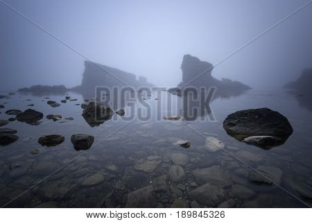 Magnificent seascape over the rock phenomenon The Ships, Sinemorets village, Bulgaria. Foggy weather.