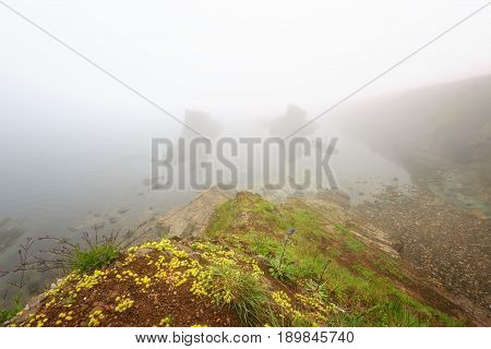 Magnificent seascape over the rock phenomenon The Ships, Sinemorets village, Bulgaria. Foggy weather.