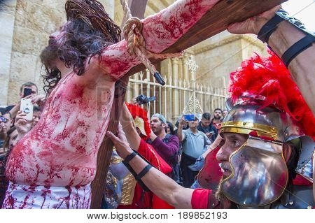JERUSALEM - APRIL 14 : Christian pilgrims re-enact the crucifixtion of Jesus along the Via Dolorosa in Jerusalem during Good friday on April 14 2017