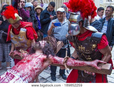 JERUSALEM - APRIL 14 : Christian pilgrims re-enact the crucifixtion of Jesus along the Via Dolorosa in Jerusalem during Good friday on April 14 2017