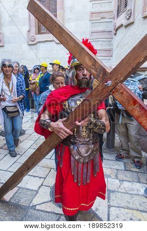 JERUSALEM - APRIL 14 : Christian pilgrim re-enact the crucifixtion of Jesus along the Via Dolorosa in Jerusalem during Good friday on April 14 2017