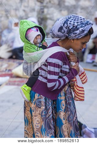 JERUSALEM - APRIL 15 : Ethiopian Orthodox worshipers waiting for the Holy fire ceremony to begin at the Ethiopian section of the Holy Sepulcher in Jerusalm Israel on April 15 2017