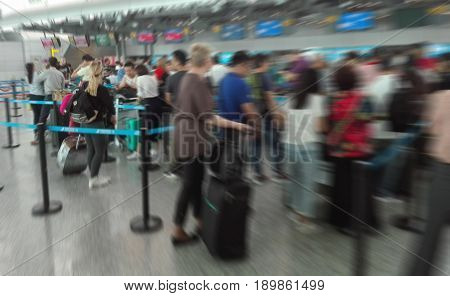 Abstract Blur Background Airport Check-In Counters With Many Passengers in queue With Bokeh