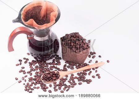 Coffee beans for drip coffee and black coffee in the glass jar coffee filter on white background.