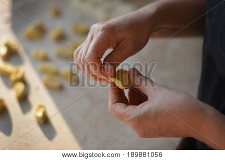 Process of making dumplings, raw ravioli in flour in details