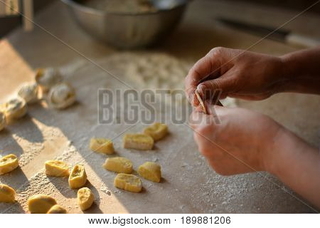 Process of making dumplings, raw ravioli in flour in details