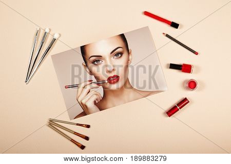 Fashion lady accessories collage. Falt Lay. Beauty photography. Make-Up brushes. Jewelry and nail polish. Beautiful woman paints lips with red lipstick. Nails and manicure