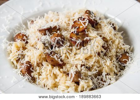 Mushroom Risotto With Parmesan Cheese. Italian Food. Simple Back