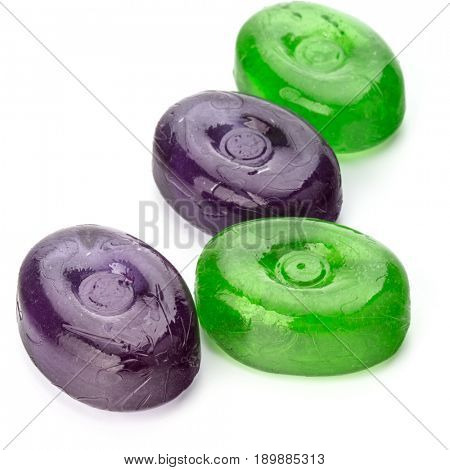 Four colorful fruit hard sugar candies,  boiled sweeties or sugar plums isolated on white background cutout