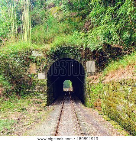 Tunnel and steam narrow-gauge railway from Yuejin to Bagou in the jungle. Jiayang Mining Region. Sichuan province. China